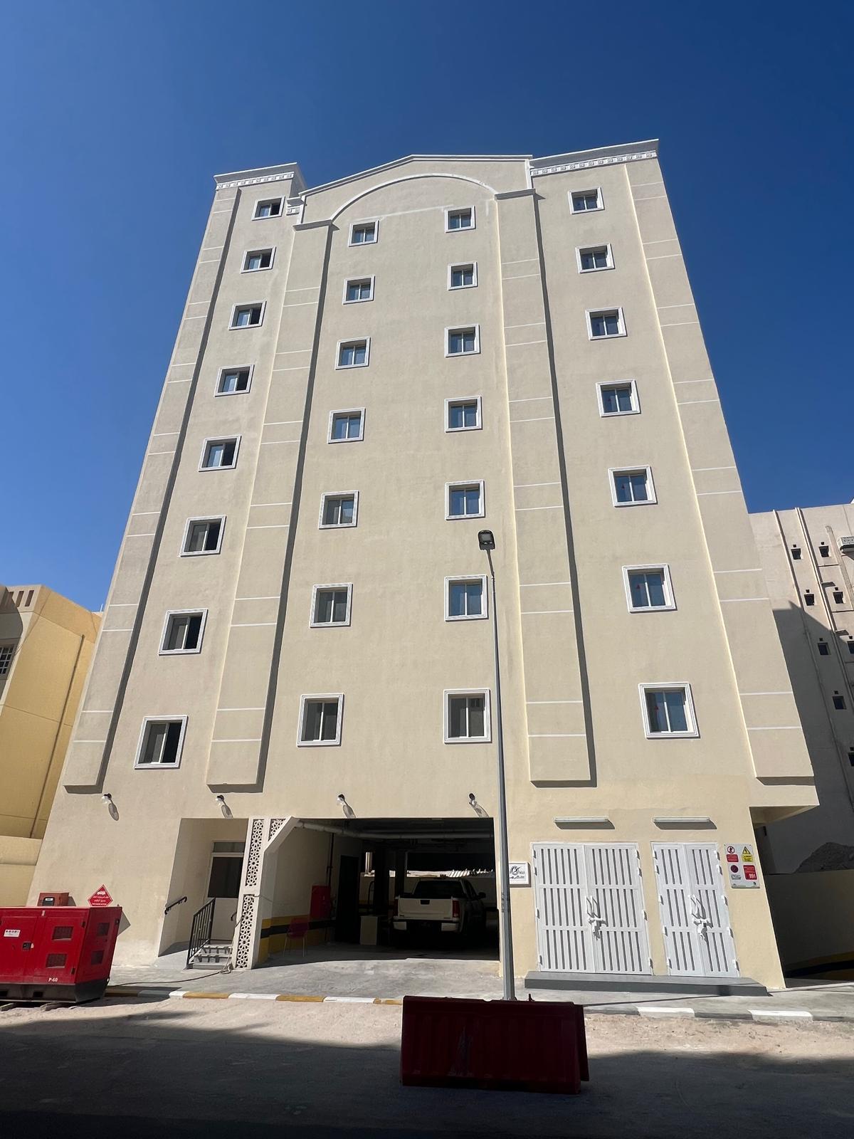 Front view of a residential building with a beige facade