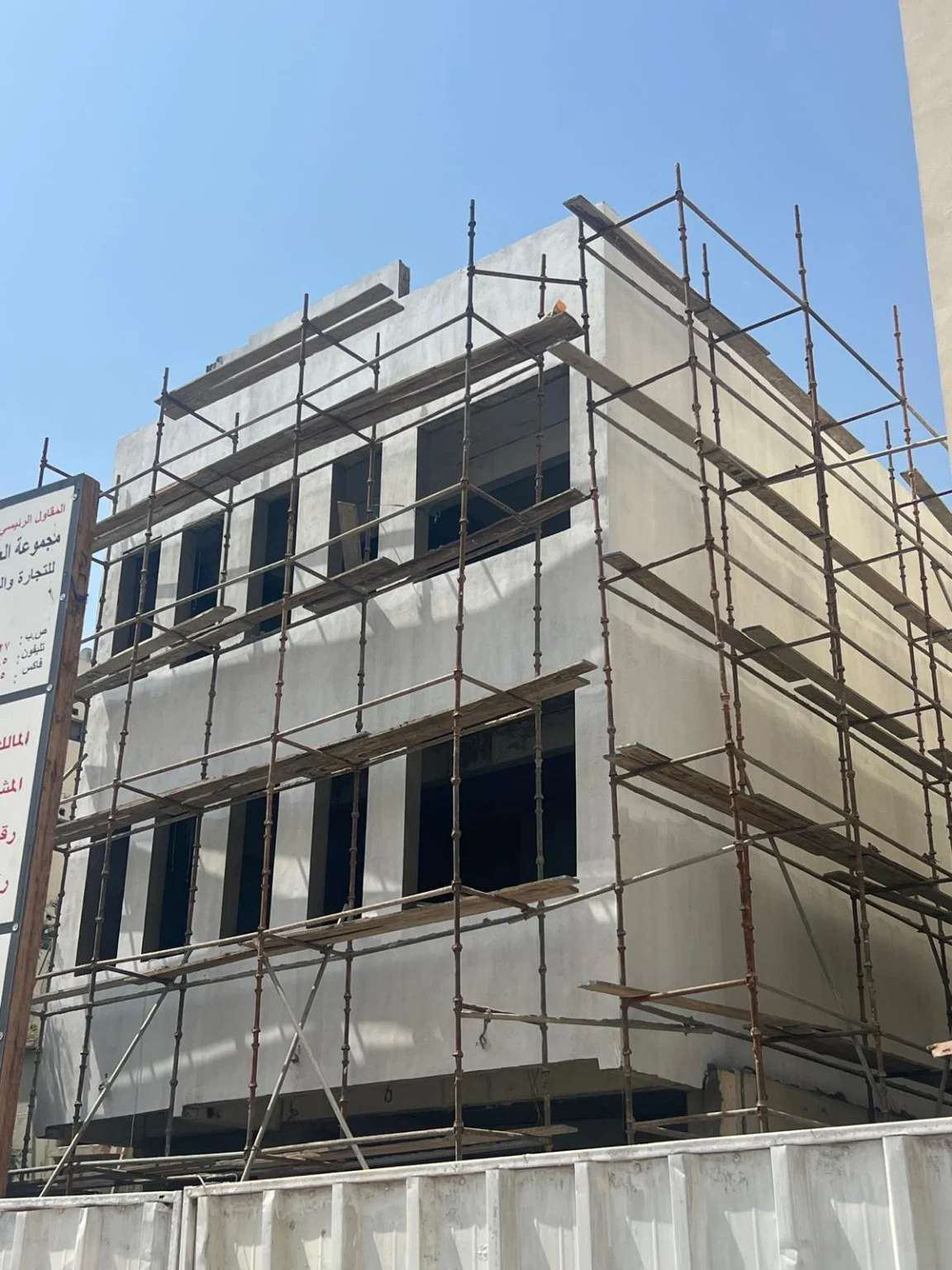 Building under construction with external scaffolding