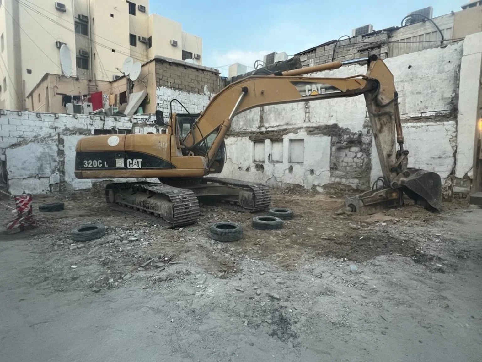 Excavator carrying out site preparation