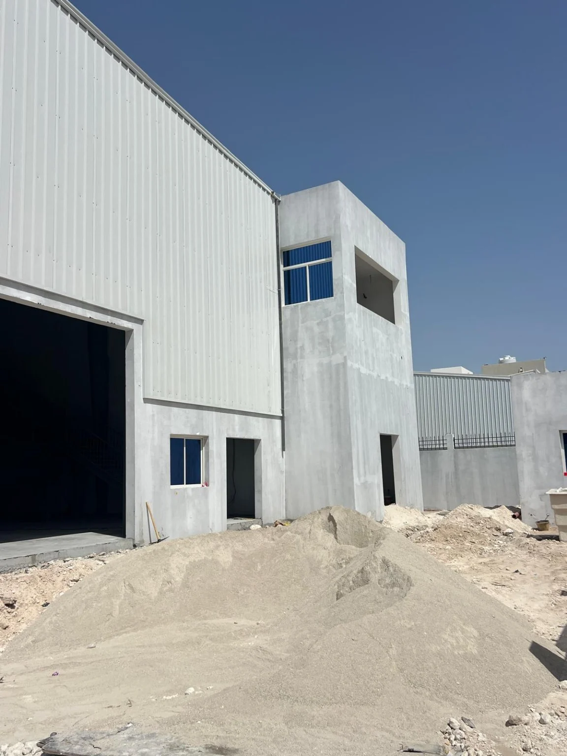 Warehouse exterior under construction with metal cladding